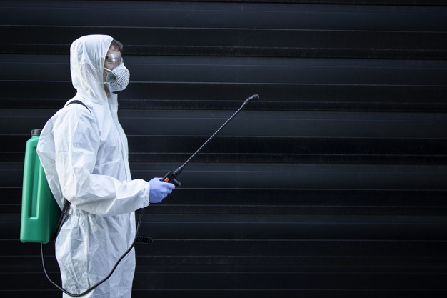 person-white-chemical-protection-suit-holding-sprayer-with-disinfectant-chemicals-stop-spreading-highly-contagious-virus_342744-925-d863c501
